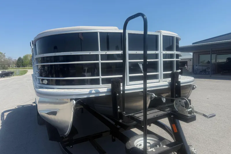 Slide: The Image of 2026 Trifecta 22 LE RF LE 2.75 pontoon boat on trailer, sunny day. - 4