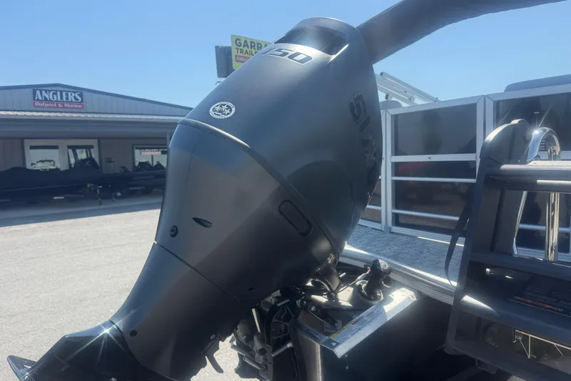 Slide: The Image of Outboard motor on a 2026 Trifecta 22 LE RF LE 2.75 boat at a dealership. - 5