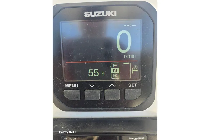 Slide: The Image of Suzuki digital display showing 0 RPM and 55 hours on a 2023 Layton Bay 22 boat. - 10