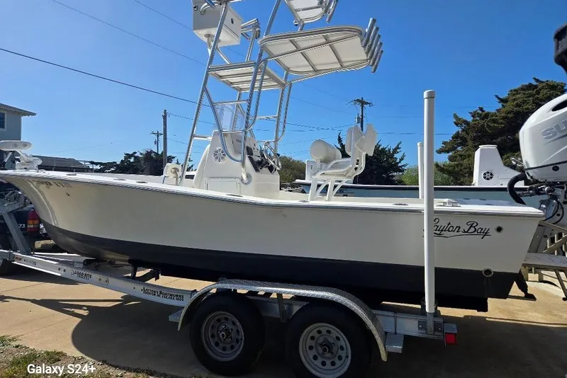 Slide: The Image of 2023 Layton Bay 22 boat on trailer, featuring elevated seating and sleek design. - 3