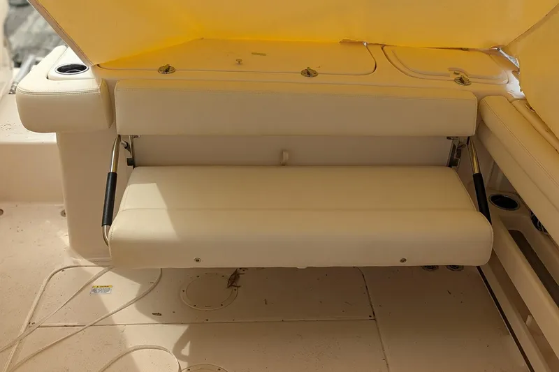 Slide: The Image of 2025 Grady-White Freedom 275 boat interior with toilet and mirror. - 12
