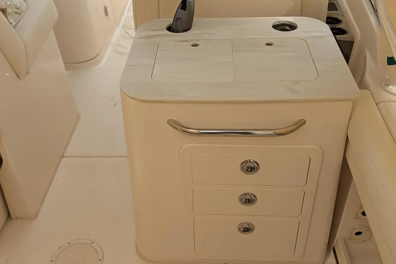 Slide: The Image of 2025 Grady-White Freedom 275 boat interior with helm and controls. - 13