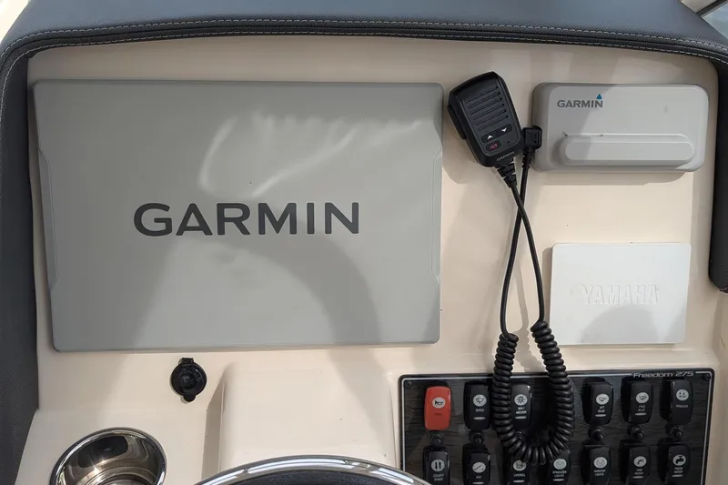 Slide: The Image of Yamaha display on 2025 Grady-White Freedom 275 boat showing trip and total hours. - 15