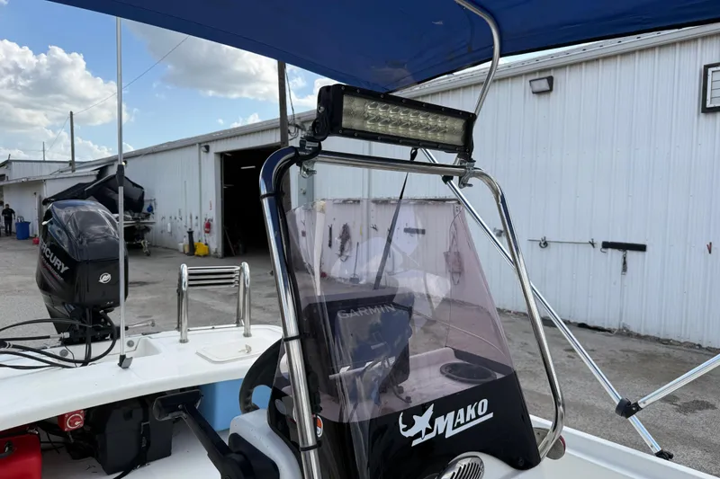 Slide: The Image of 2018 Mako Pro Skiff 17 CC boat with Mercury engine and Garmin equipment. - 22