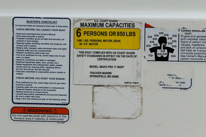 Slide: The Image of 2018 Mako Pro Skiff 17 CC capacity and safety checklist labels. - 31