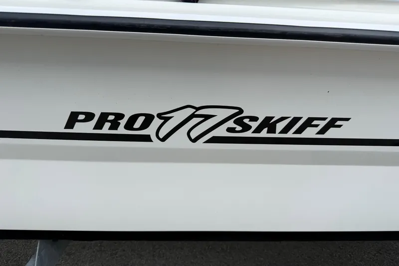 Slide: The Image of 2018 Mako Pro Skiff 17 CC boat logo on white hull. - 36