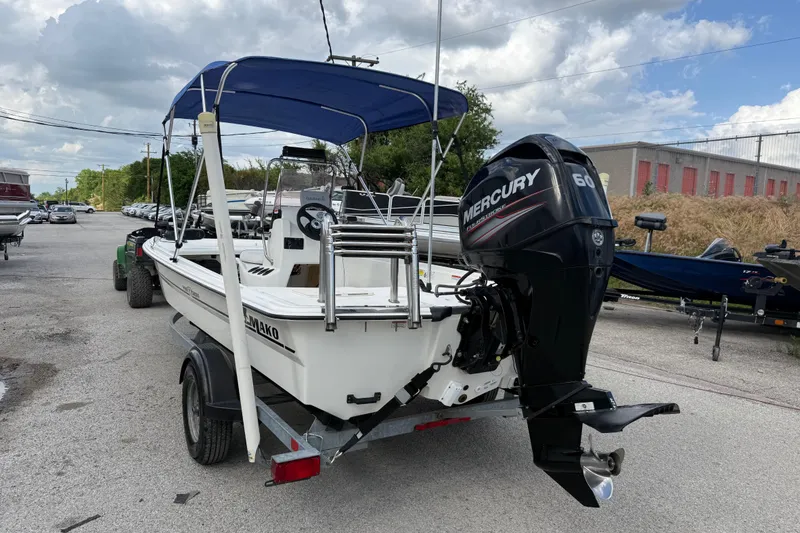 Slide: The Image of 2018 Mako Pro Skiff 17 CC boat with Mercury 60 engine on trailer. - 9