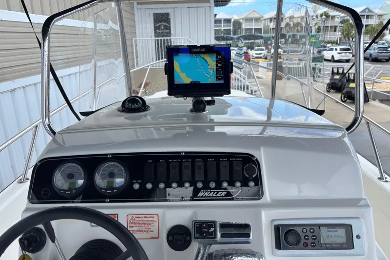 Slide: The Image of Dashboard of a 2005 Boston Whaler 220 Dauntless with navigation equipment. - 17