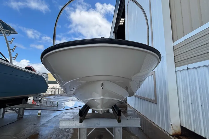 Slide: The Image of 2005 Boston Whaler 220 Dauntless boat on trailer, dockside view. - 3