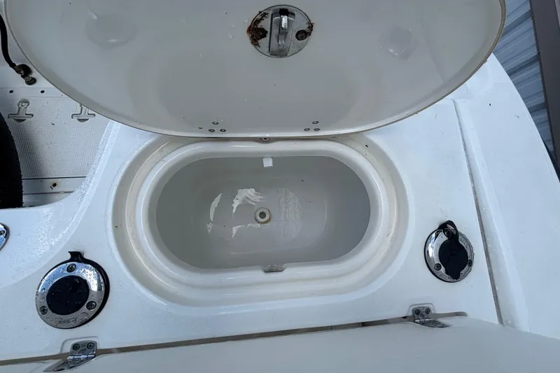Slide: The Image of Open storage compartment on a 2005 Boston Whaler 220 Dauntless boat. - 9
