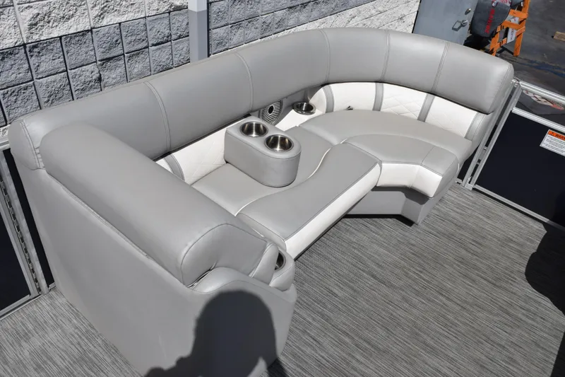 Slide: The Image of Luxurious seating on 2021 Bennington L 23 Swingback pontoon boat with cup holders. - 12