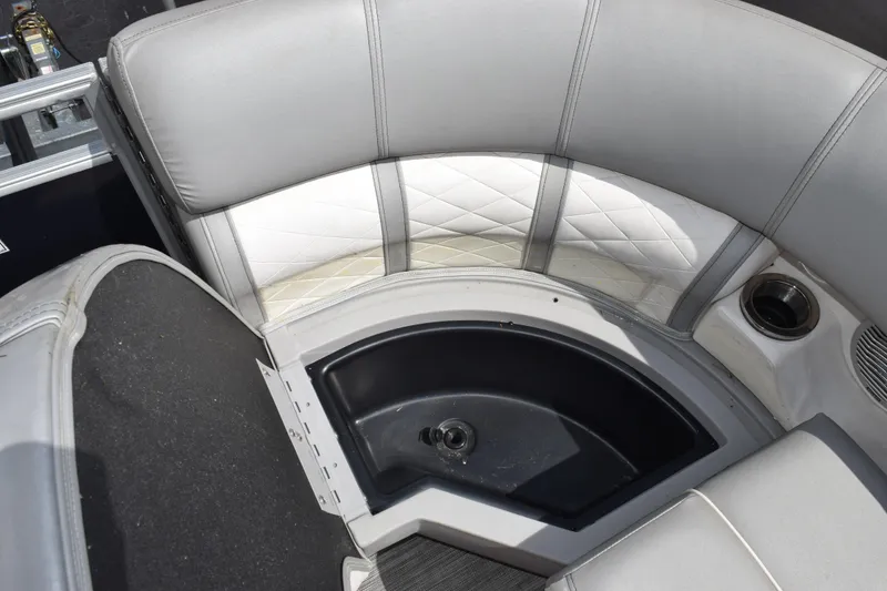 Slide: The Image of Interior seating of 2021 Bennington L 23 Swingback boat with storage compartment. - 15