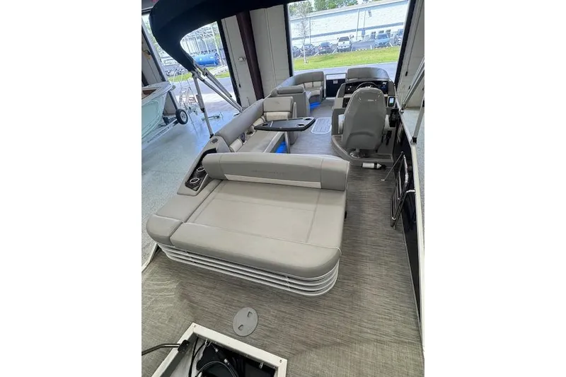 Slide: The Image of 2021 Bennington L 23 Swingback pontoon boat interior with gray seating and modern design. - 22