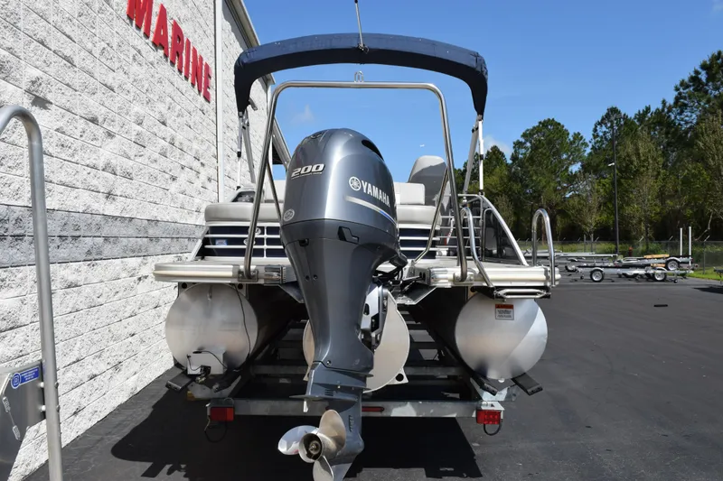 Slide: The Image of 2021 Bennington L 23 Swingback pontoon boat with Yamaha 200 engine, parked outdoors. - 5