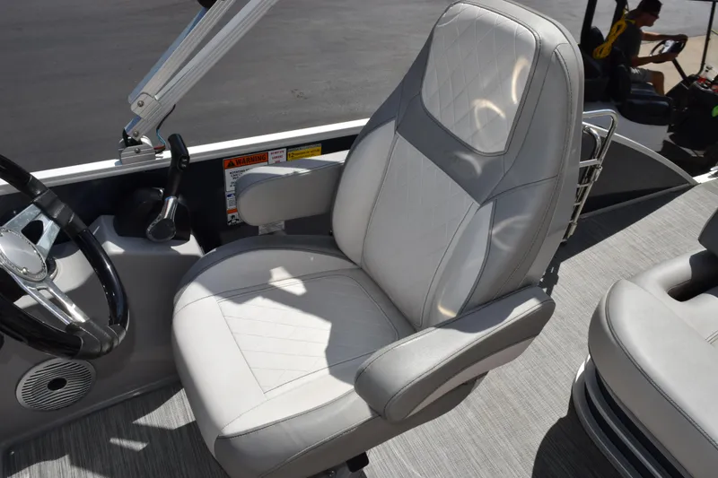 Slide: The Image of Captain's chair on 2021 Bennington L 23 Swingback pontoon boat, featuring sleek design and comfort. - 9