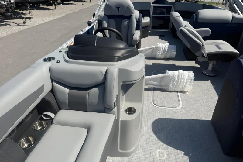 Slide: The Image of 2026 Trifecta 22RFCS3 pontoon boat interior with gray seating and steering console. - 13