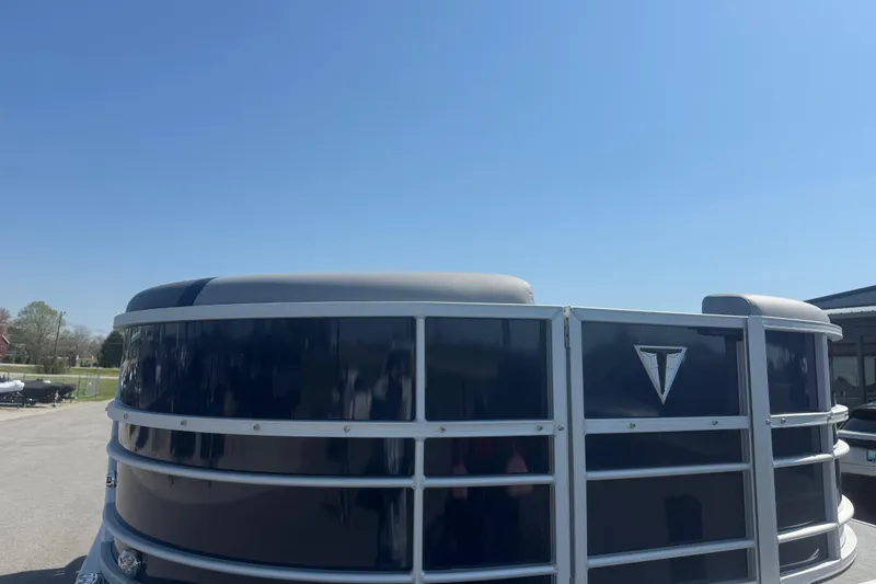 Slide: The Image of 2026 Trifecta 22RFCS3 pontoon boat with sleek design under clear blue sky. - 4