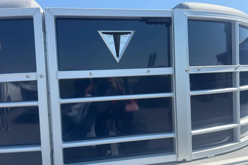 Slide: The Image of 2026 Trifecta 22RFCS3 pontoon boat with sleek blue paneling and silver trim. - 5