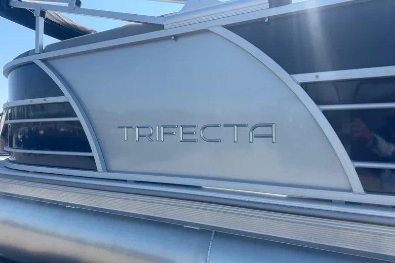 Slide: The Image of 2026 Trifecta 22RFCS3 pontoon boat, sleek design with metallic accents. - 6