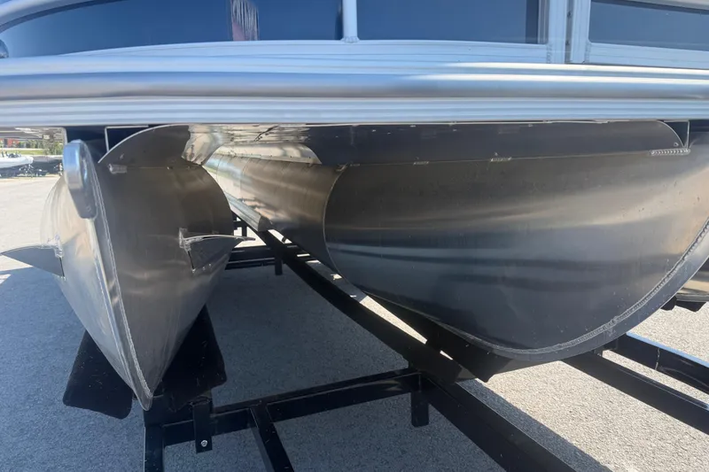 Slide: The Image of 2026 Trifecta 22RFCS3 pontoon boat underside view on trailer. - 7