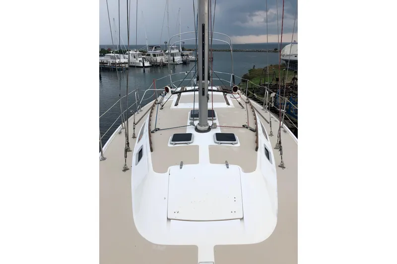 Slide: The Image of 1985 Catalina 36 MkII sailboat deck view at marina, overcast sky. - 11