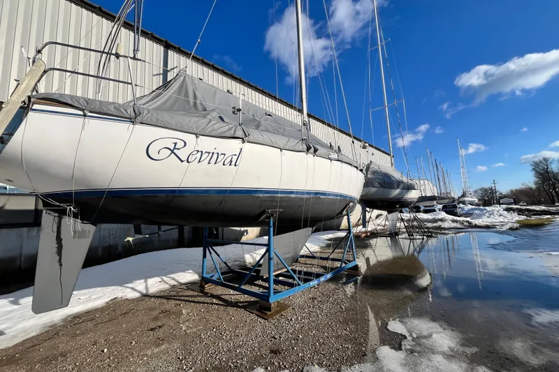 Slide: The Image of Catalina 36 MkII sailboat "Revival" on stands, winter storage, clear blue sky. - 2
