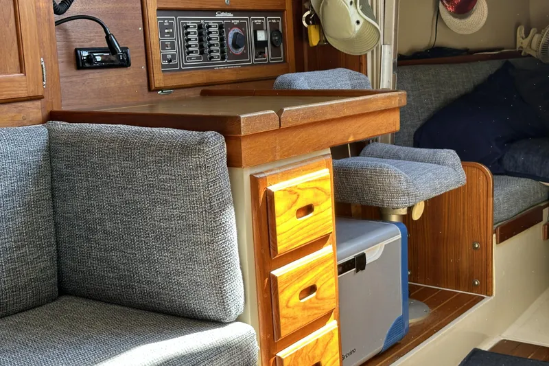 Slide: The Image of Interior of a 1985 Catalina 36 MkII sailboat with wood cabinetry and cushioned seating. - 14