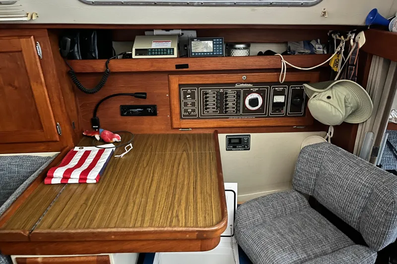 Slide: The Image of Interior of a 1985 Catalina 36 MkII sailboat with navigation equipment and seating area. - 6