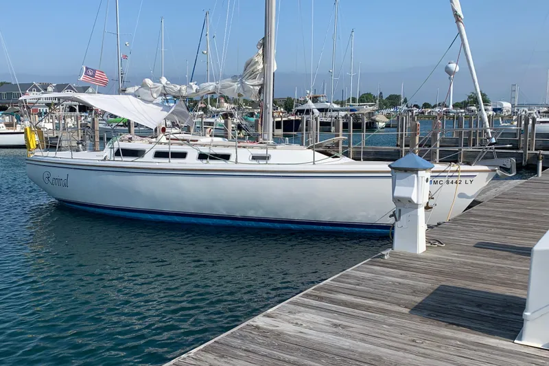 Slide: The Image of Catalina 36 MkII sailboat docked at marina, 1985 model, named "Revival". - 9
