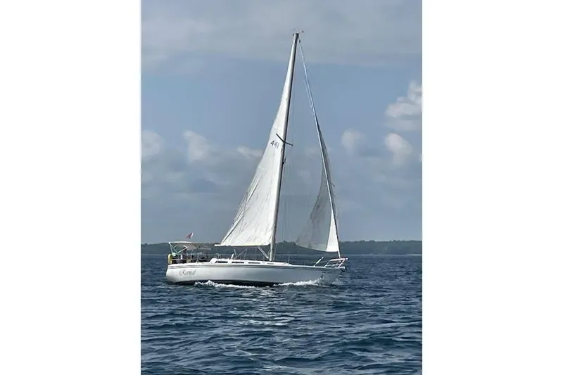 Slide: The Image of Sailing yacht Catalina 36 MkII, 1985 model, cruising on open water under clear skies. - 19