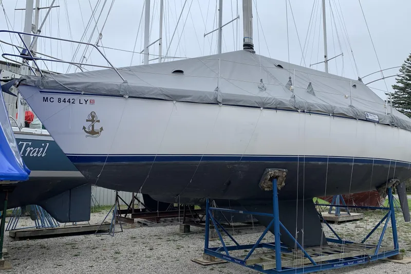 Slide: The Image of Catalina 36 MkII sailboat from 1985 on stands, covered and stored outdoors. - 18