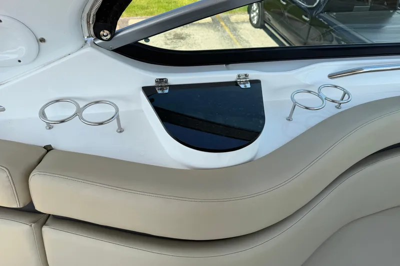 Slide: The Image of Interior of 2019 Rinker EX 320 boat with cup holders and seating. - 10