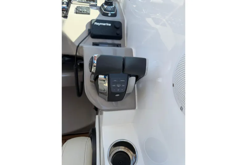 Slide: The Image of 2019 Rinker EX 320 boat deck with hatch and windshield detail. - 28