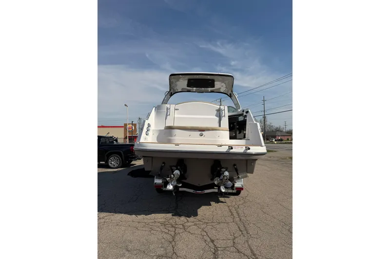 Slide: The Image of Control panel of a 2019 Rinker EX 320 boat with navigation and media systems. - 33