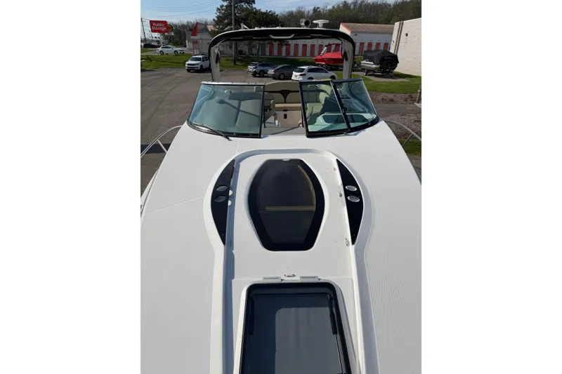 Slide: The Image of Control panel of 2019 Rinker EX 320 boat with buttons and switches. - 35