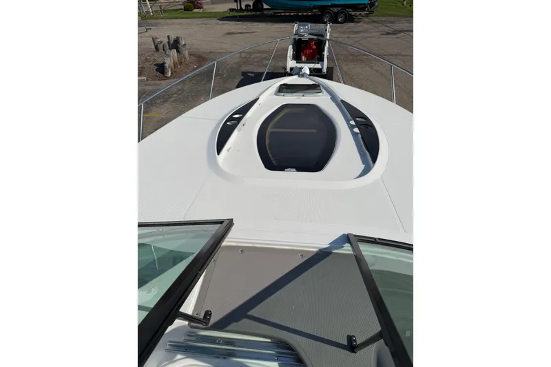 Slide: The Image of Control panel of a 2019 Rinker EX 320 boat featuring Raymarine electronics. - 36