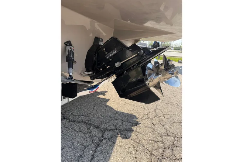 Slide: The Image of 2019 Rinker EX 320 boat with MerCruiser outdrive and dual propellers. - 65