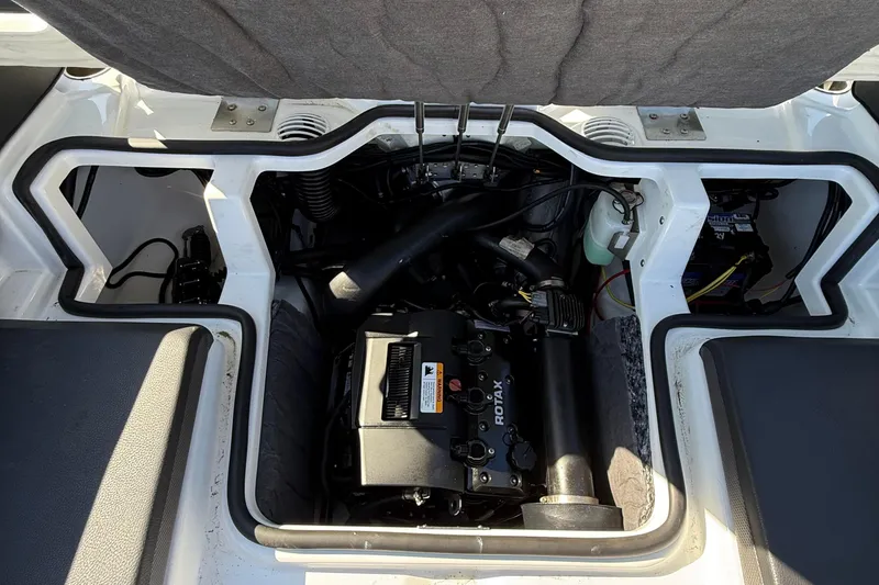Slide: The Image of Engine compartment of 2024 Scarab 195 ID boat, featuring a Rotax engine. - 17
