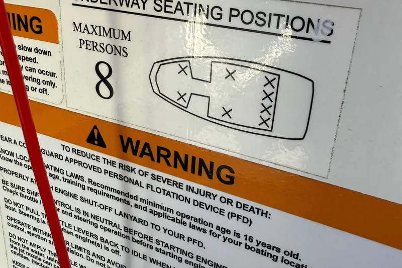 Slide: The Image of Scarab 195 ID 2024 warning label, maximum capacity 8 persons, safety instructions. - 18