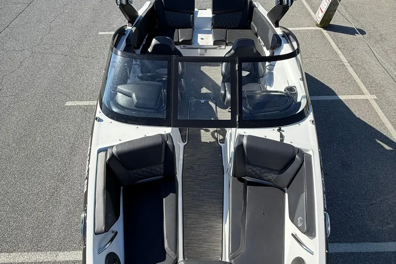Slide: The Image of 2024 Scarab 195 ID boat interior, featuring sleek seating and modern design. - 9