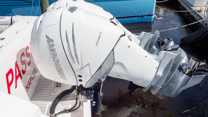 Slide: The Image of 2022 Intrepid 345 Valor with Mercury outboard engine, docked in Naples. - 12