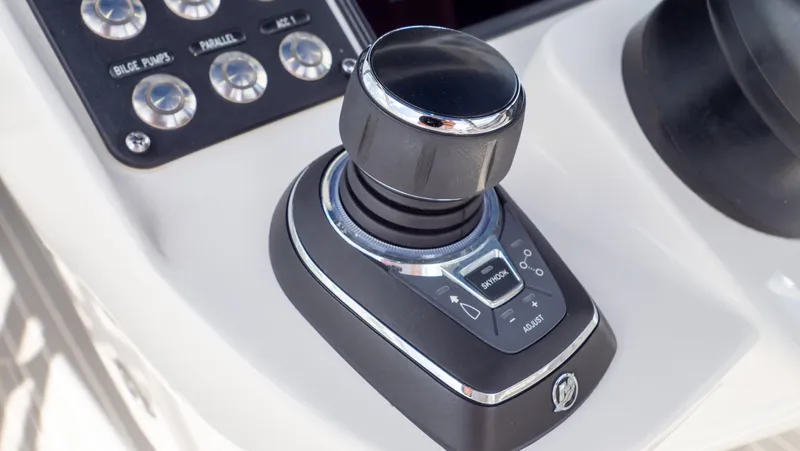Slide: The Image of Joystick control on 2022 Intrepid 345 Valor boat dashboard, featuring sleek design and functionality. - 14