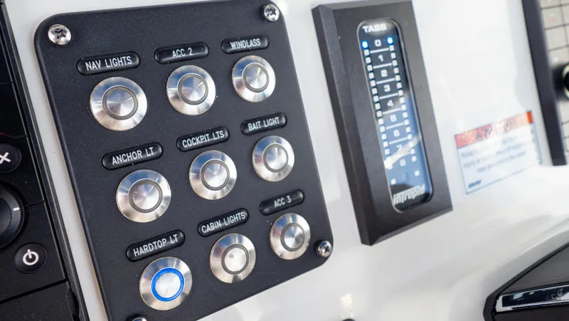 Slide: The Image of Control panel of 2022 Intrepid 345 Valor boat with labeled buttons and digital display. - 17