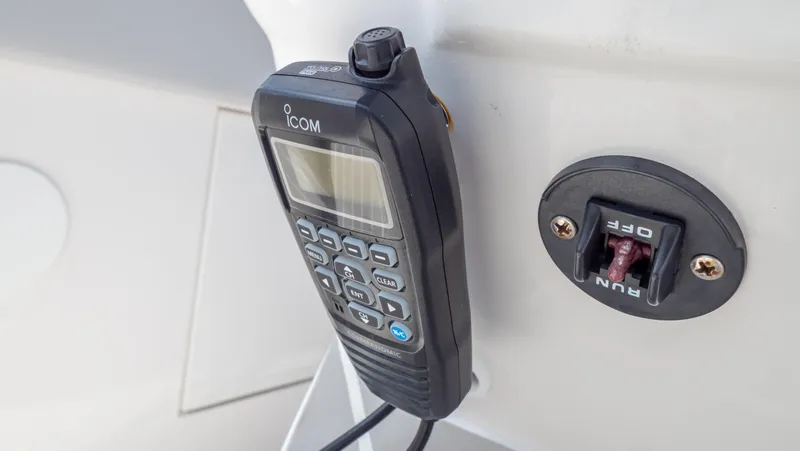 Slide: The Image of ICOM radio and control switch on 2022 Intrepid 345 Valor boat. - 26