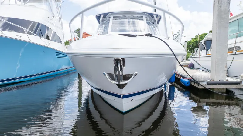 Slide: The Image of 2022 Intrepid 345 Valor boat docked at marina, front view. - 29