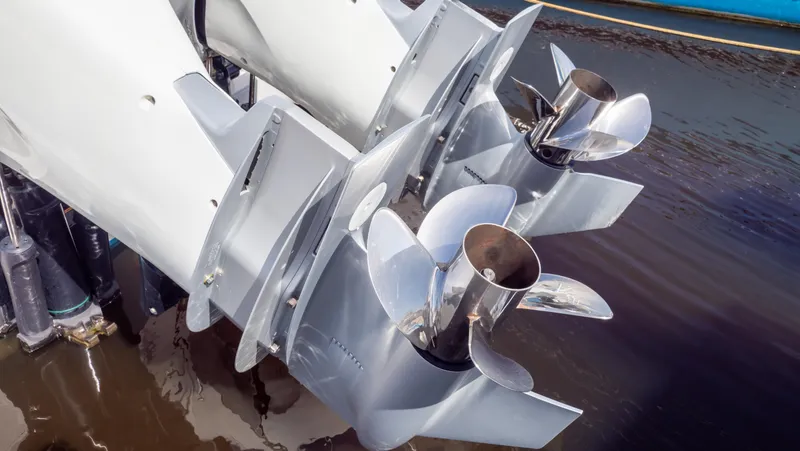 Slide: The Image of Twin propellers of a 2022 Intrepid 345 Valor boat in water. - 36