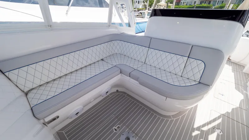 Slide: The Image of Luxurious seating on 2022 Intrepid 345 Valor boat, featuring elegant diamond-pattern upholstery. - 8