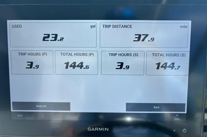 Slide: The Image of Garmin display showing fuel usage and trip data for 2023 Cobia 280 Dual Console. - 9