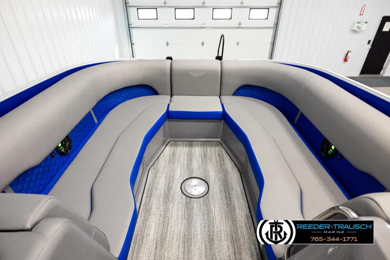 Slide: The Image of Interior of 2025 Bennington LTFBSE boat with gray and blue seating, modern design. - 18