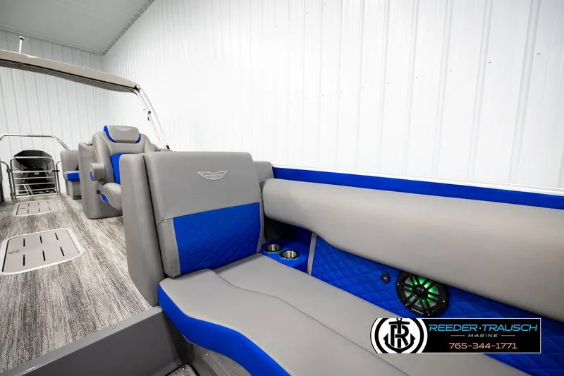 Slide: The Image of 2025 Bennington LTFBSE boat interior with gray and blue seating, modern design. - 23